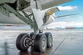 Wheels rubber tire rear landing gear racks airplane aircraft, under wing view. Royalty Free Stock Photo