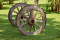 wheels with wooden spokes on a green meadow Royalty Free Stock Photo