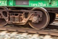 Wheelset of a railway car rushes along the rails Royalty Free Stock Photo