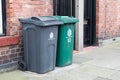 Wheely bins on pavement awaiting collection with North Tyneside Council crest and signage