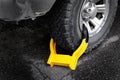 Wheel Boot or Tire Lock for Illegal Parking Violation Immobilize Vehicle Car Royalty Free Stock Photo