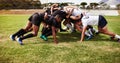 Where all of the power plays are. a group of young rugby players in a scrum on the field. Royalty Free Stock Photo