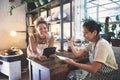 Where business and art co-exist in perfect harmony. two young women using a digital tablet during a meeting in a pottery