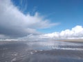 Where the clouds, sand and water meet