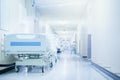 Where healing happens. Shot of a hospital bed in an empty corridor of a modern hospital. Royalty Free Stock Photo