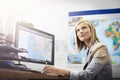 Where should I go next. a young female travel agent working in her office. Royalty Free Stock Photo