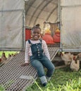 Where there are animals, theres a happy child. Portrait of a cute little girl having fun on a chicken farm. Royalty Free Stock Photo