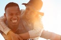 Where theres love theres happiness. a happy young couple enjoying a piggyback ride outdoors.