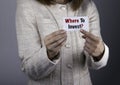 Where To Invest? Businesswoman holding a card with a message tex