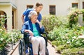 Where to next. a resident and a nurse outside in the retirement home garden. Royalty Free Stock Photo