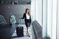 Where will your business take you. an executive businesswoman walking through an airport during a business trip.