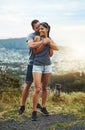 Wherever they go, love goes with. a young couple in a loving embrace outdoors. Royalty Free Stock Photo