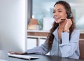 Whether you need help or advice, shes the agent for you. an attractive young female call centre agent working in her Royalty Free Stock Photo