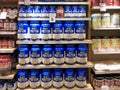 Whey protein jars on store shelf Royalty Free Stock Photo