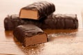 Whey protein powder and chocolate protein bar on wooden Royalty Free Stock Photo