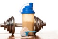 Whey protein powder in scoop, dumbbell, meter tape and plastic s Royalty Free Stock Photo