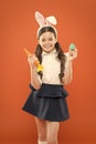 Which one do you want. child bunny costume with carrot. little happy girl hold painted eggs. egg hunt began. healthy