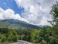 Which is one of Turkey`s most beautiful sights highway between Olympos Antalya, sparkling and blue skies, nature and trees.