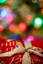 Ribbon on a christmas gift, bokeh lights background Royalty Free Stock Photo