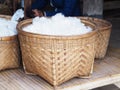 Whiie silk cotton in bamboo basket Royalty Free Stock Photo