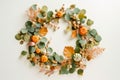 Whimsical Autumn Wreath with Foliage, Flowers, and Mini Pumpkins - Generative AI