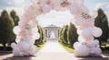 A whimsical balloon arch framing the exit path for theer