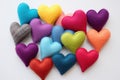 Whimsical Colorful woolen hearts. Heart craft on table
