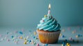 Whimsical cupcake with blue pastel frosting and a single candle, generative ai