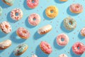 Whimsical delight pink donuts with colorful sprinkles on blue background