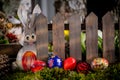 Whimsical Easter Scene: Handcrafted Eggs, Cute Bunny Cutout, and Rustic Fence Royalty Free Stock Photo