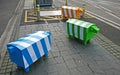 Three blocky animal sculptures. Colorful sheep traffic safety bollards on stone pedestrian sidewalk in Christchurch, New Zealand Royalty Free Stock Photo