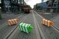 Three blocky animal sculptures. Colorful sheep traffic safety bollards on road with tramway tracks in Christchurch, New Zealand Royalty Free Stock Photo