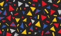 Whimsical geometric pattern featuring triangles, rectangles and circles in red yellow blue and grey on a speckled dark Royalty Free Stock Photo