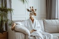 Whimsical giraffe enjoying a cozy day in a white bathrobe at home, concept of humor and relaxation.