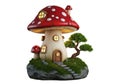Whimsical mushroom house with tiny tree and mossy stone path Royalty Free Stock Photo