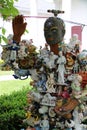 Whimsical artwork of man covered with all types of figurines, Woodstock, NY, summer 2021