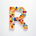 Whimsical Pill Letter R: Detailed Shapes And Vibrant Colors