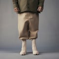 Whimsical Rubber Man In Tan Pants And White Boots