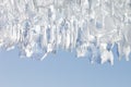 Whimsical surface ice closeup on blue sky background. Royalty Free Stock Photo