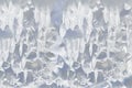 Whimsical surface ice with snow closeup on blue sky background.