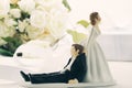 Whimsical wedding cake figurines on white Royalty Free Stock Photo