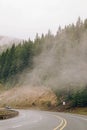 Whining mountain road with a car in a distance Royalty Free Stock Photo