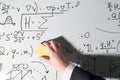 Whiping the whiteboard. Complex math formulas. Mathematics and science Royalty Free Stock Photo