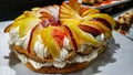 Whipped cream cake decorated with pear, apple and peach wedges Royalty Free Stock Photo