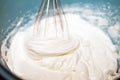 Whipped cream, a heavy, double cream, or other high-fat cream, that is whipped by a whisk or mixer until it is light and fluffy