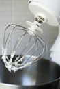 Whipped egg whites or frosting on electric mixer whisk. Baking dessert concept. vertical size Royalty Free Stock Photo