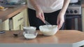 Whipped egg yolks with sugar in a glass bowl