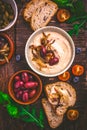 Whipped feta cheese dip with garlic, olives, lemon and caramelized onions