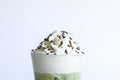 Whipping cream with chocolate sugar topping on ice matcha and green tea on white background. Sweet and delicious snack at party Royalty Free Stock Photo