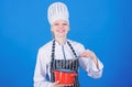 Whipping cream tips and tricks. Woman professional chef hold whisk and pot. Whipping like pro. Girl in apron whipping Royalty Free Stock Photo